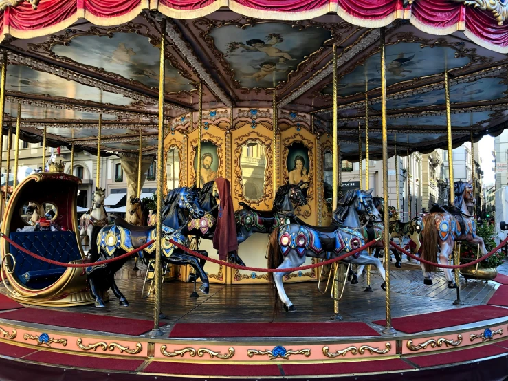 an old fashioned merry go round with horses