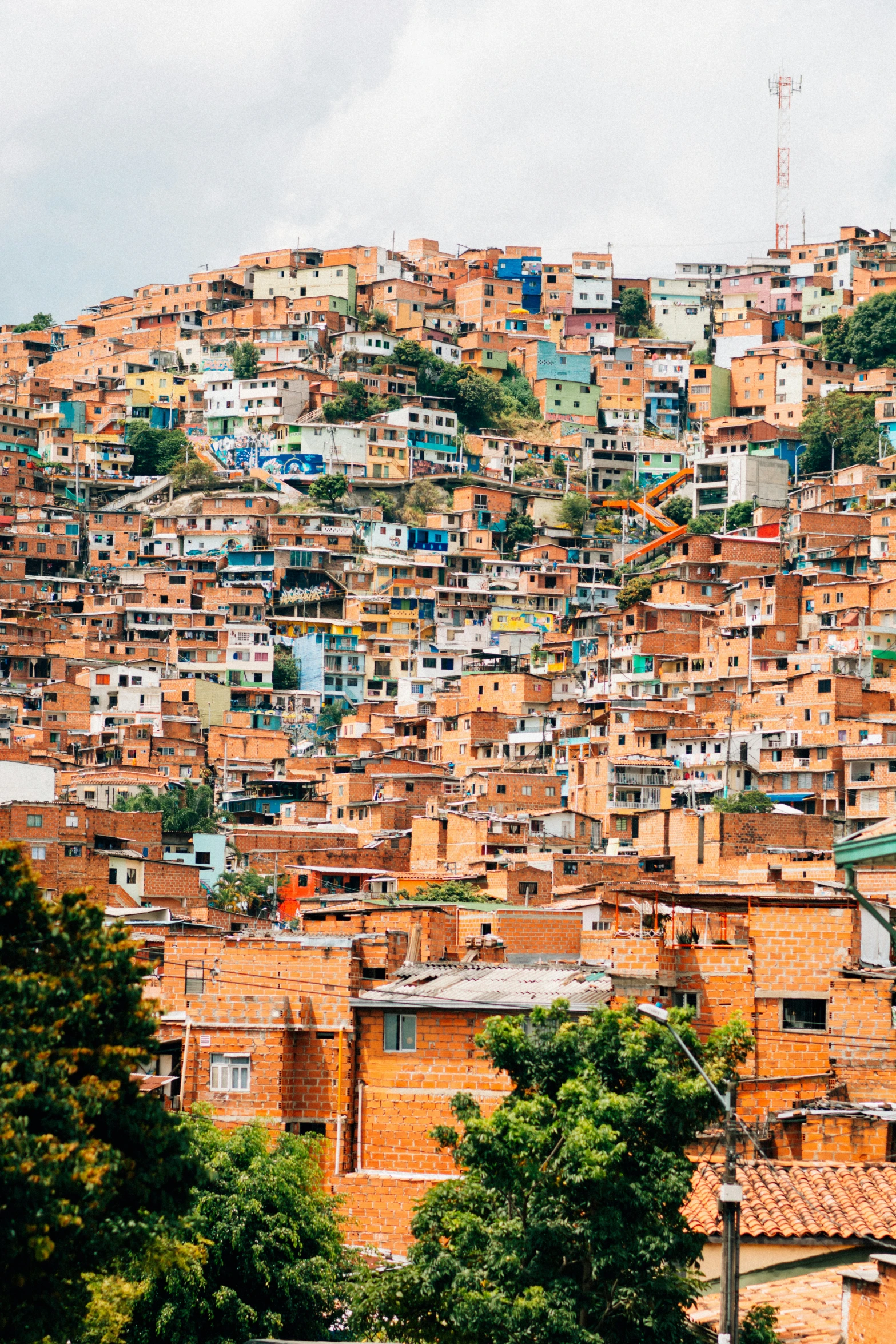 an outdoor s of several rows of houses on the hillside