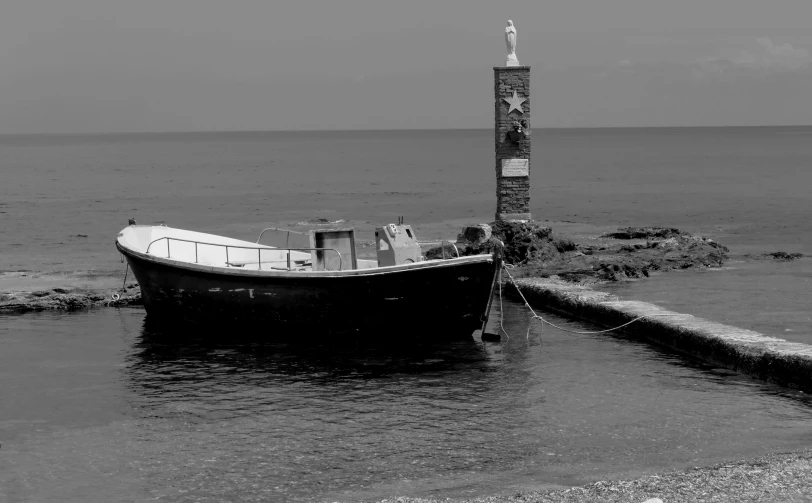 the boat is tied up near the jetty