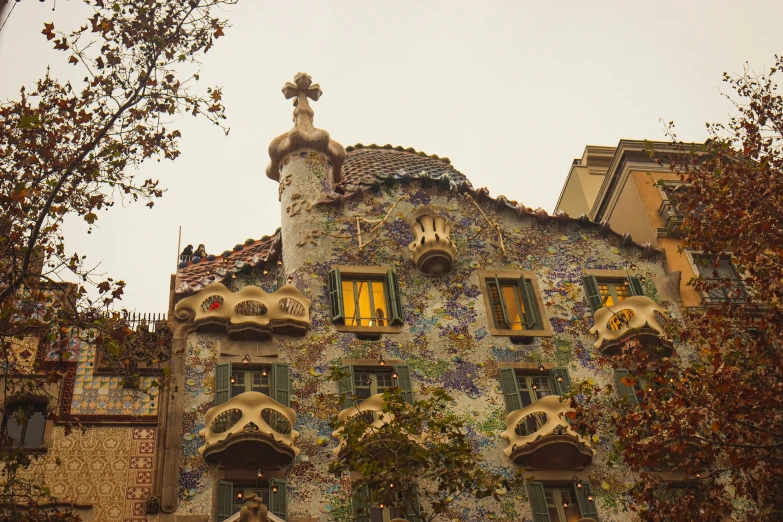 a multi - colored building with sculptures and windows