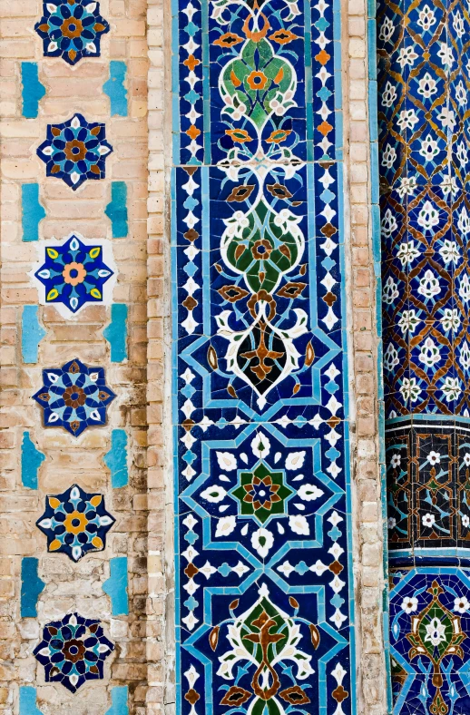 oriental rugs and patterns are shown on the wall of a building