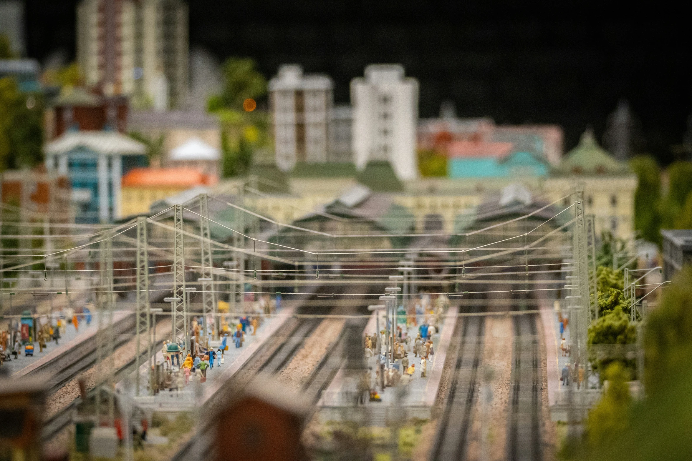 a train yard with some tracks running between the buildings