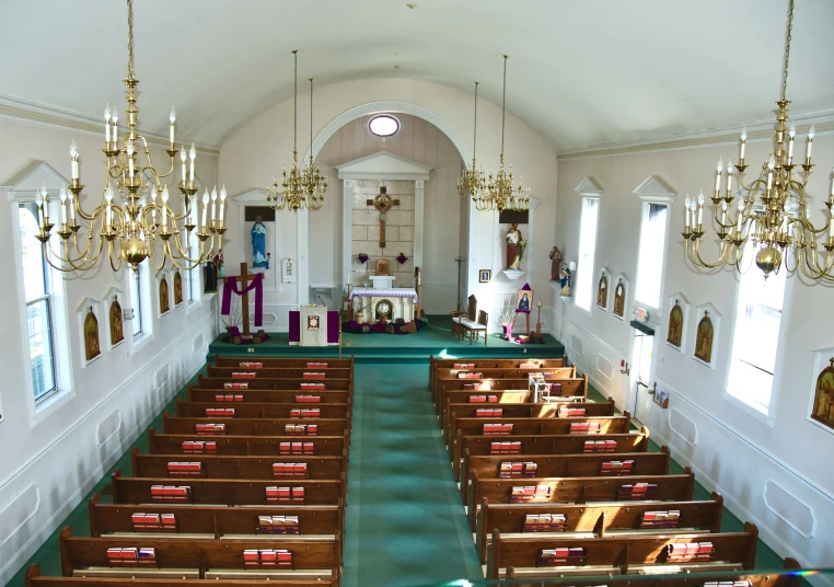 a large church with rows of pews lined up