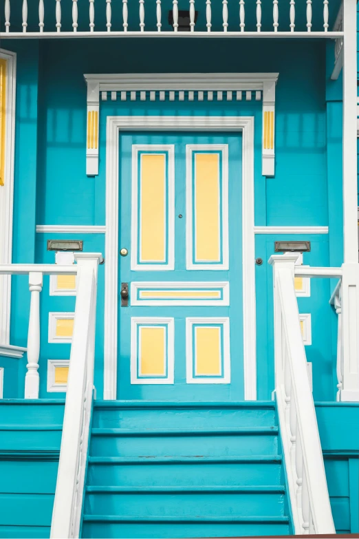 the steps and railings in front of the door of a home