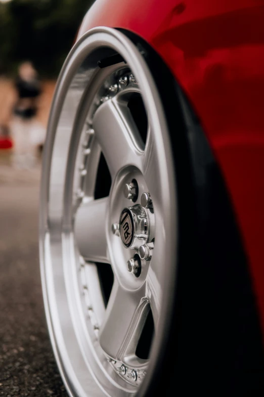 a close up of the wheel on a red car
