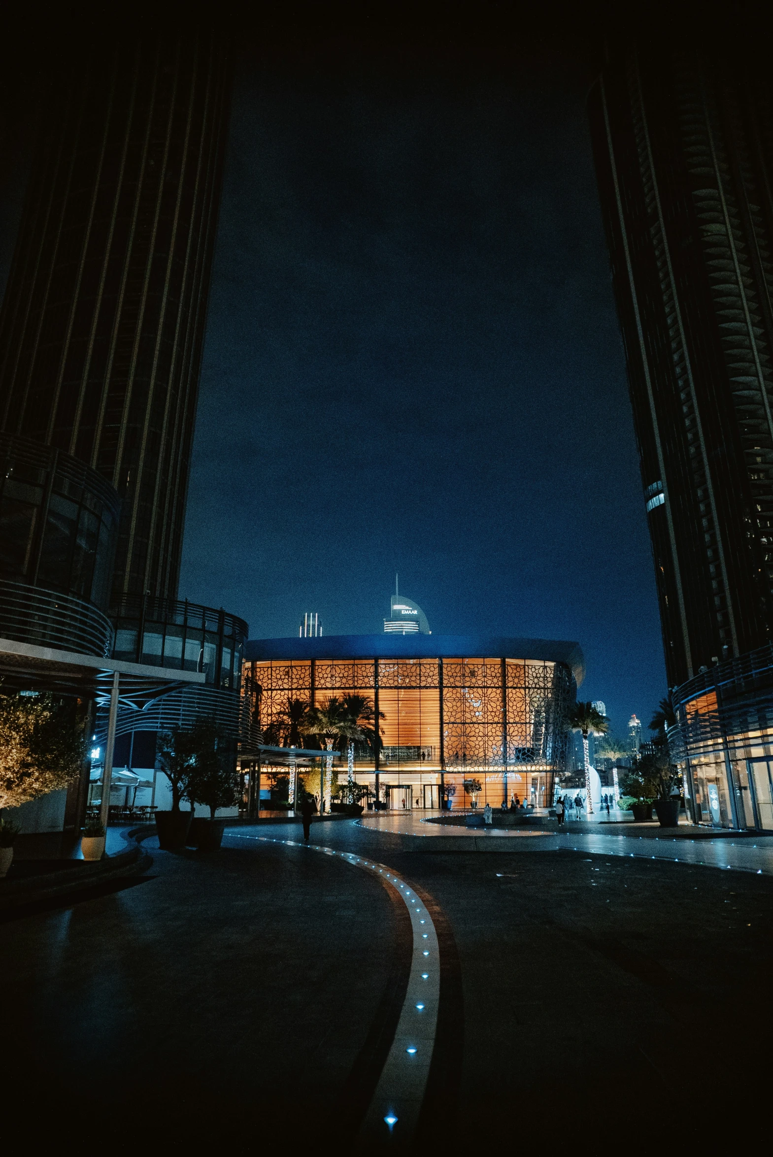 a building is lit up at night in the city