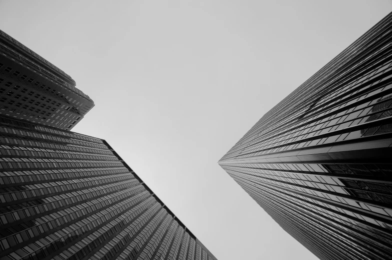 the two large buildings are tall and black