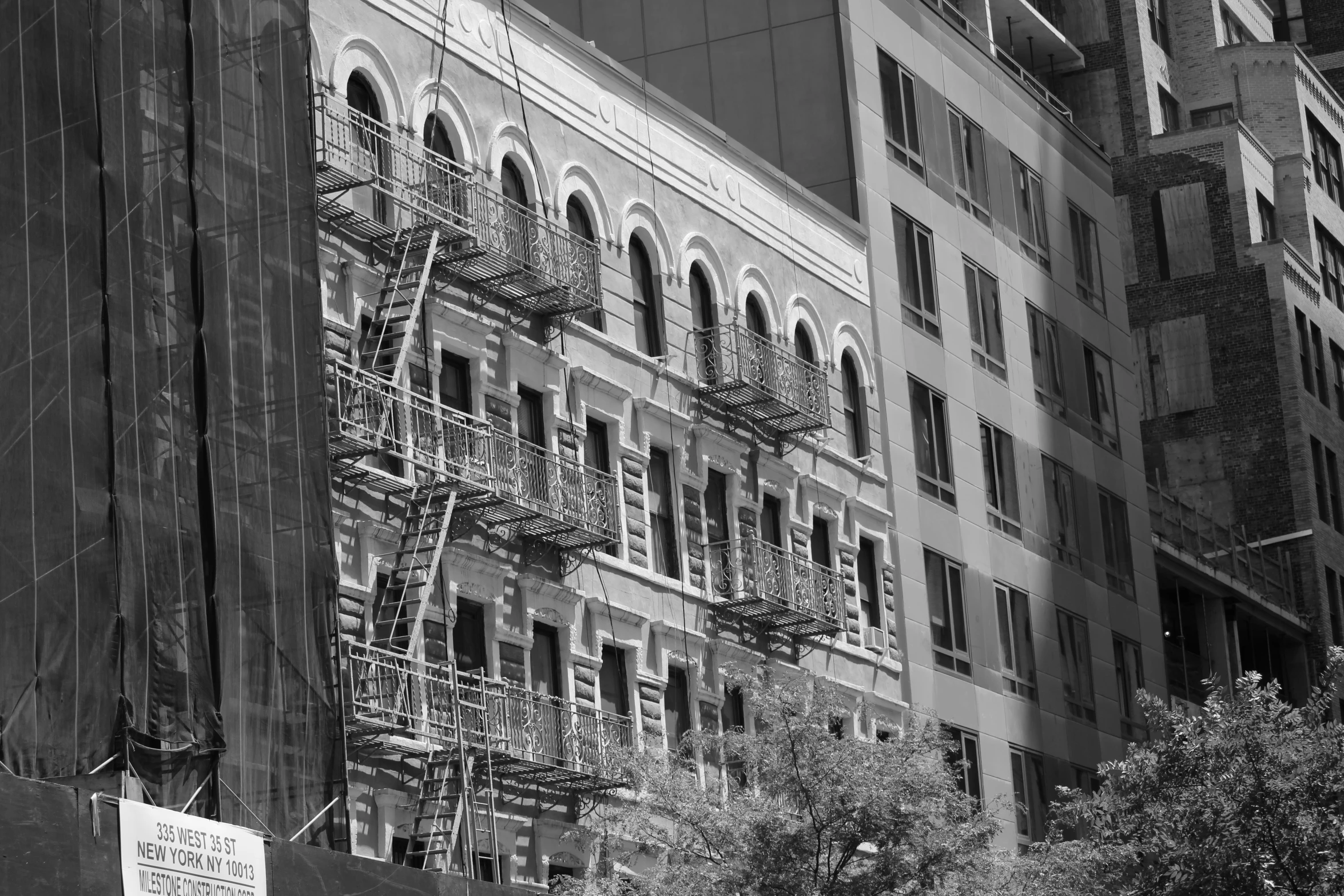 a black and white po of a building with multiple windows