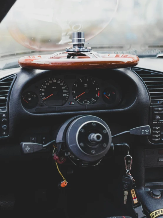 the dashboard of a car with a wooden dash board and gauges