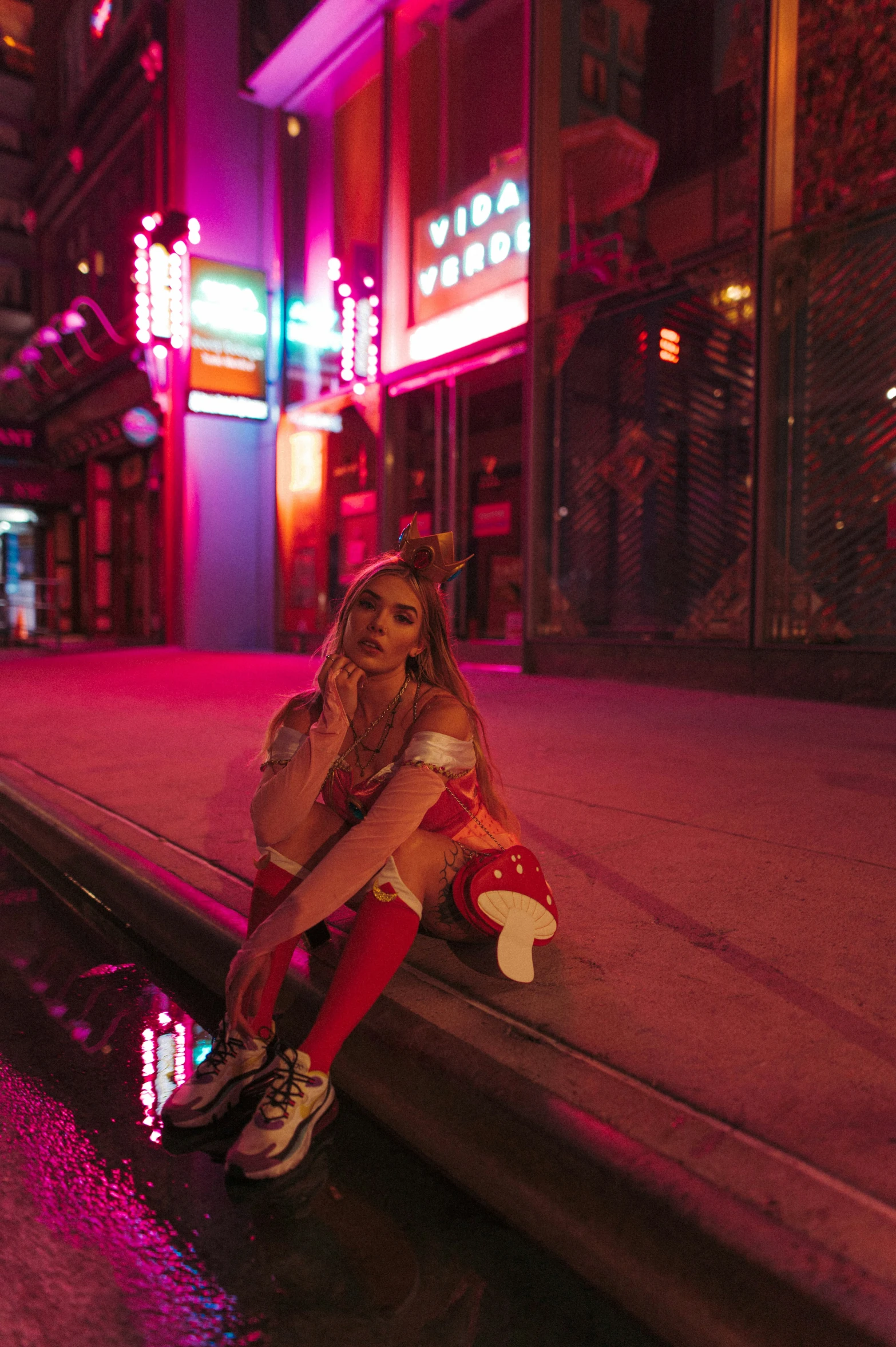 a woman is posing on a dock with a santa clause outfit