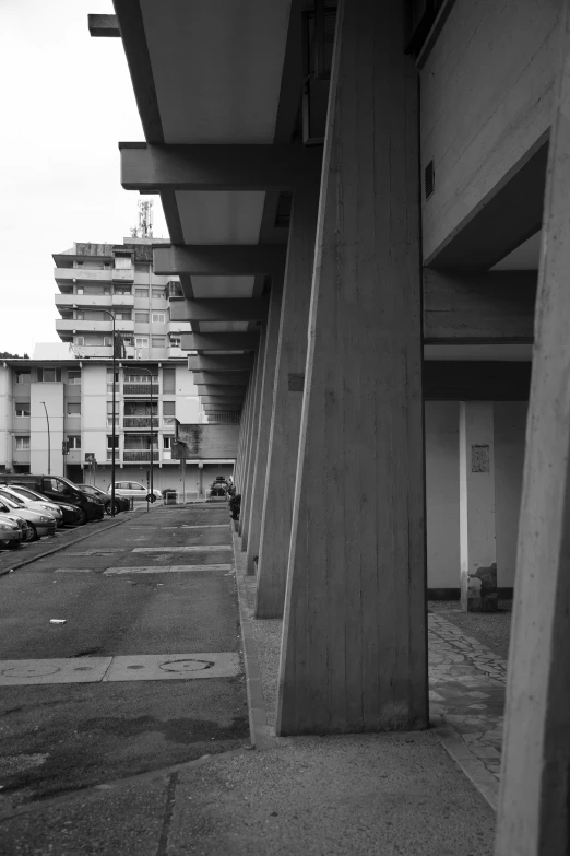 a view of parking lots between several buildings