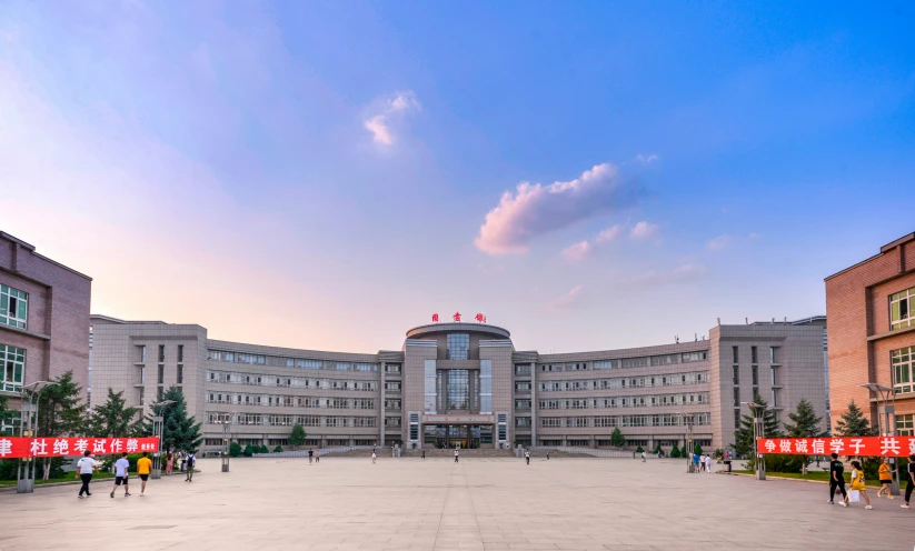 a large building with chinese characters on it's roof