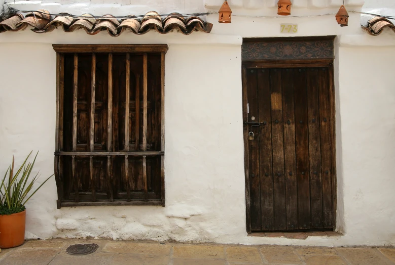 a small building with windows that look like old buildings