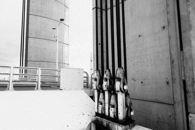 black and white image of two sculptures in the foreground