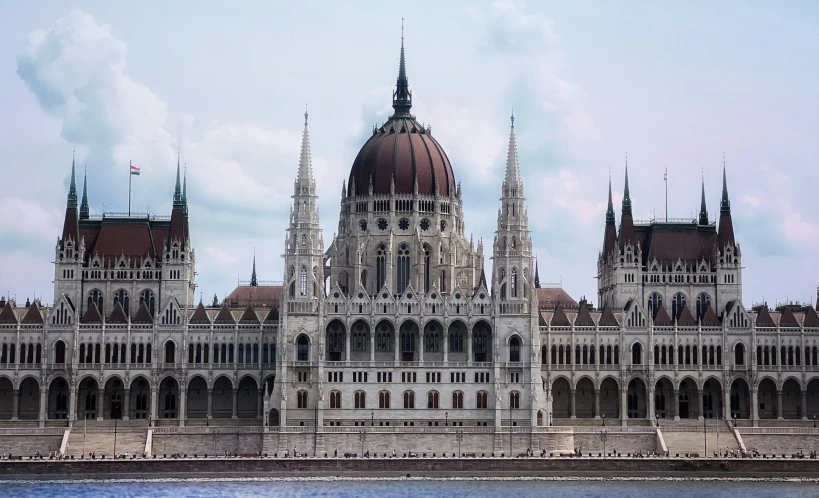 a view of the parliament building across a river