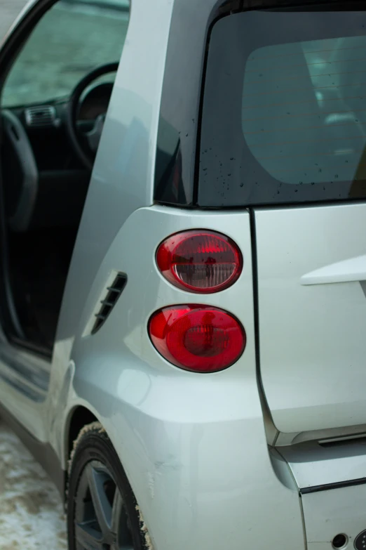 the back end of an open hatchback minivan