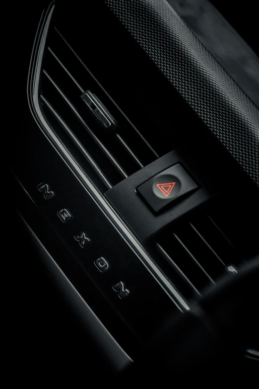 the air vents in a car have ons with red arrow