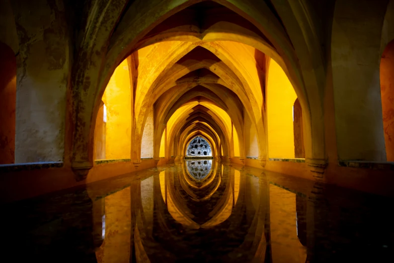 arches are lined up in a long building