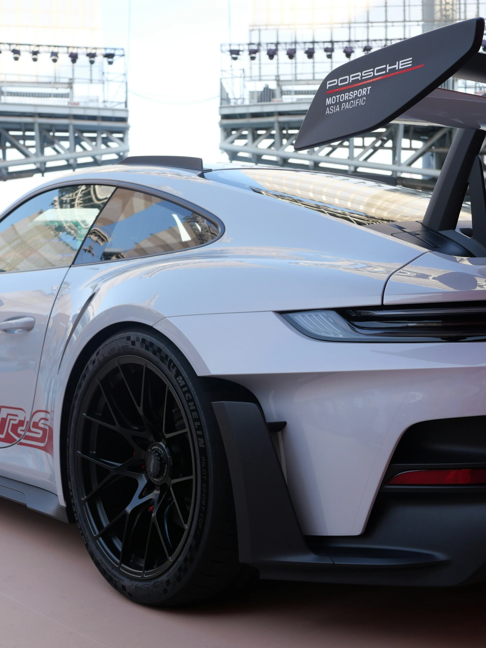 the bmw project 1 race car is parked in front of the track