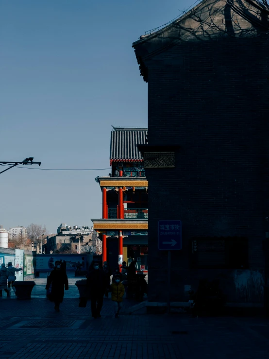 a clock tower sitting in the center of a city