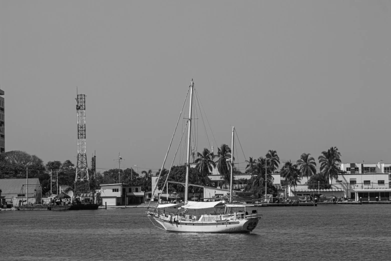 black and white pograph of sail boat in the water