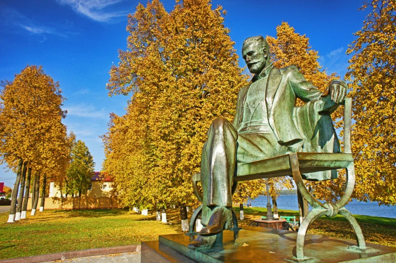 a statue of a man with his arm extended and his back turned