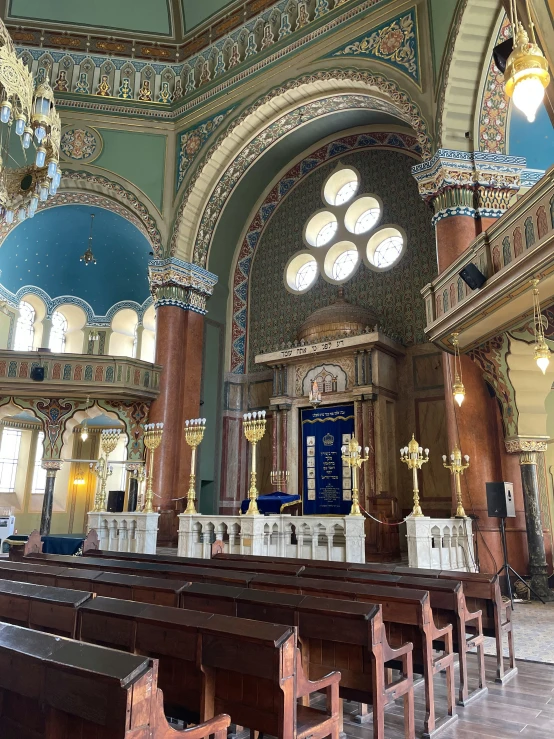 a chapel with several different alters and gold columns