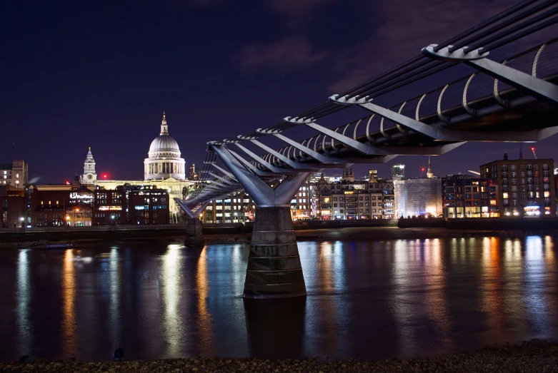 a bridge spanning over a city at night