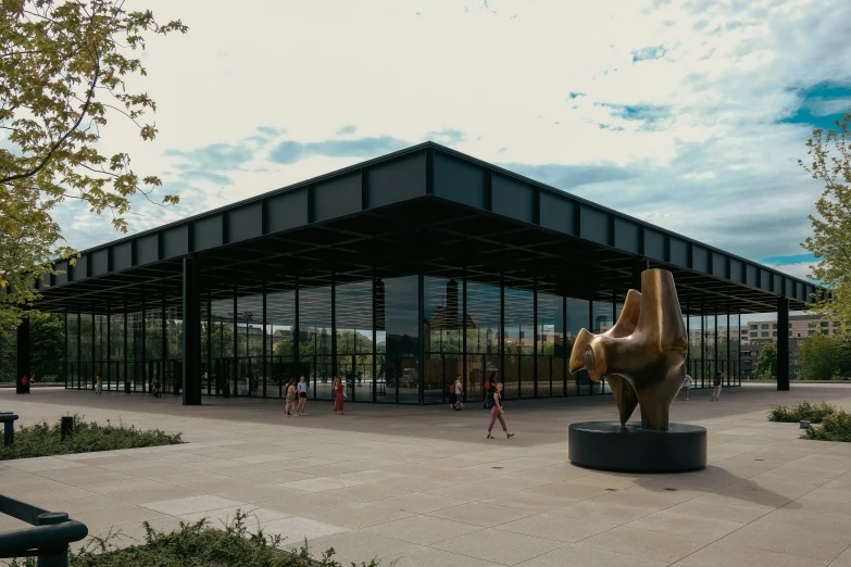 a building with a bronze horse head in front of it