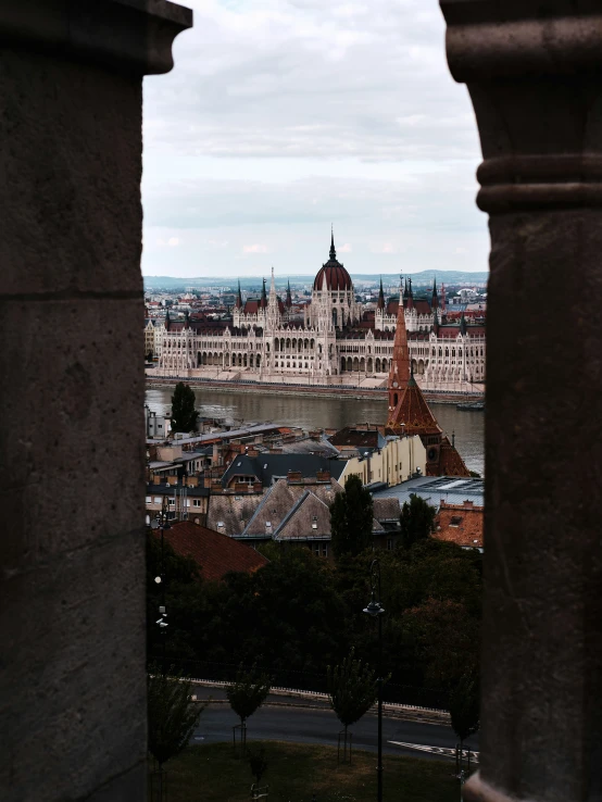 looking across a river towards a city with old buildings