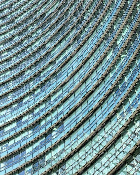 a large building with many rows of blue shutters on it