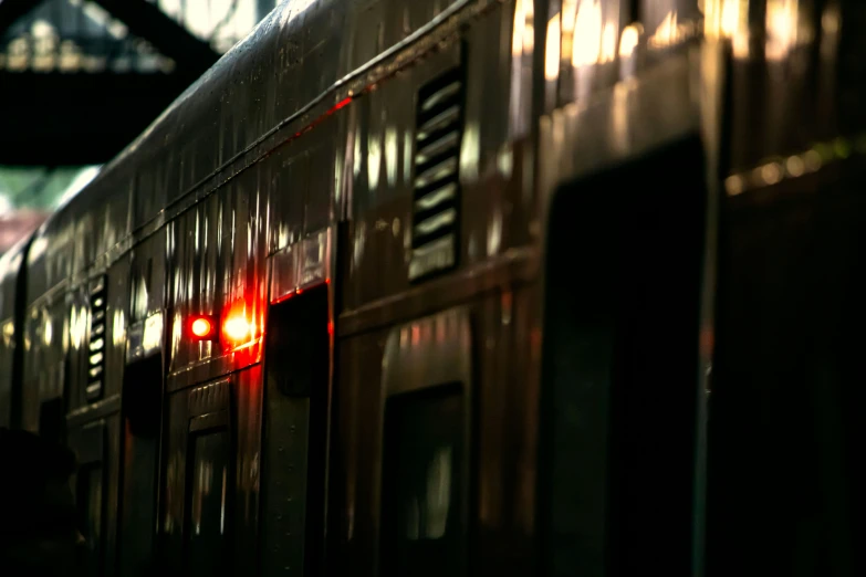 an empty train car with red light on the side