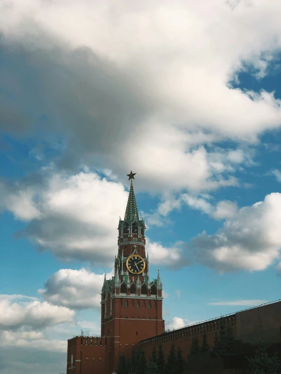 this is a very tall clock tower in front of a castle