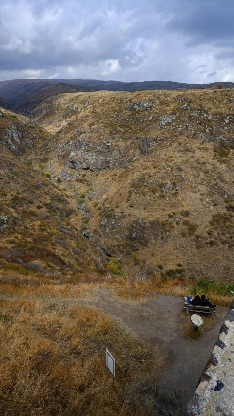 a hill that is very large with a couple of tents