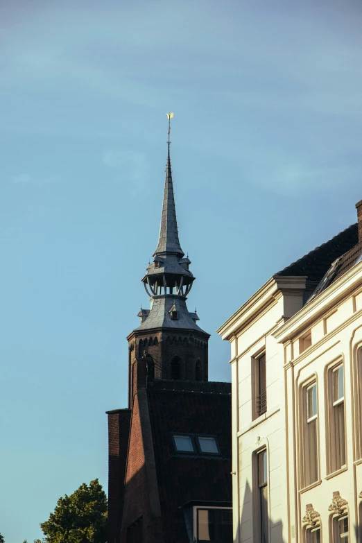 a steeple and houses in a small village