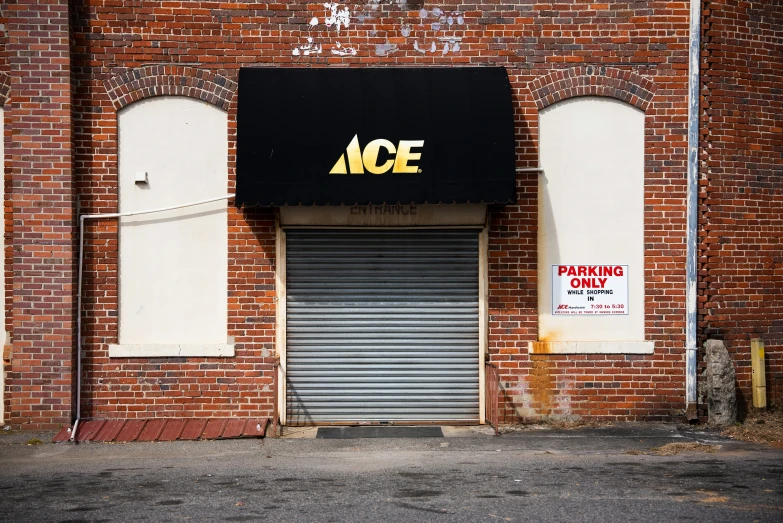 an empty garage door in front of a closed building