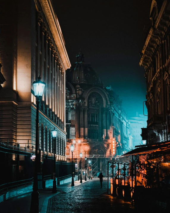 a city street with people walking around the area and buildings