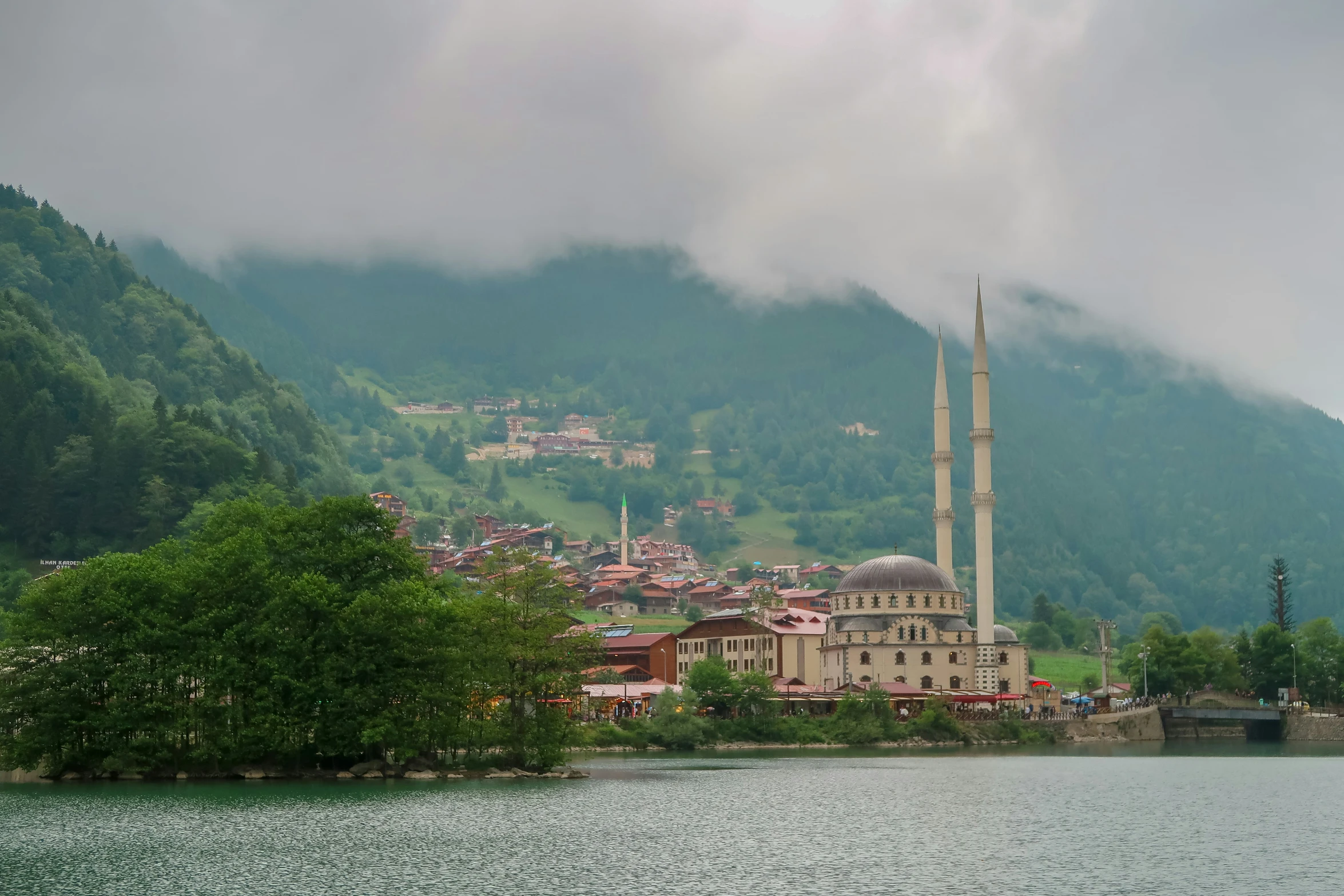 an old mosque on top of a hill overlooking a small town