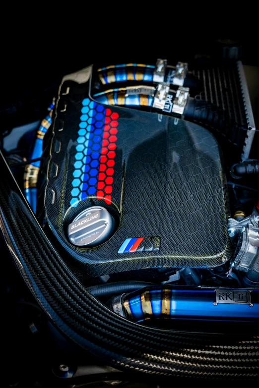 the engine cover is black and has multiple colors