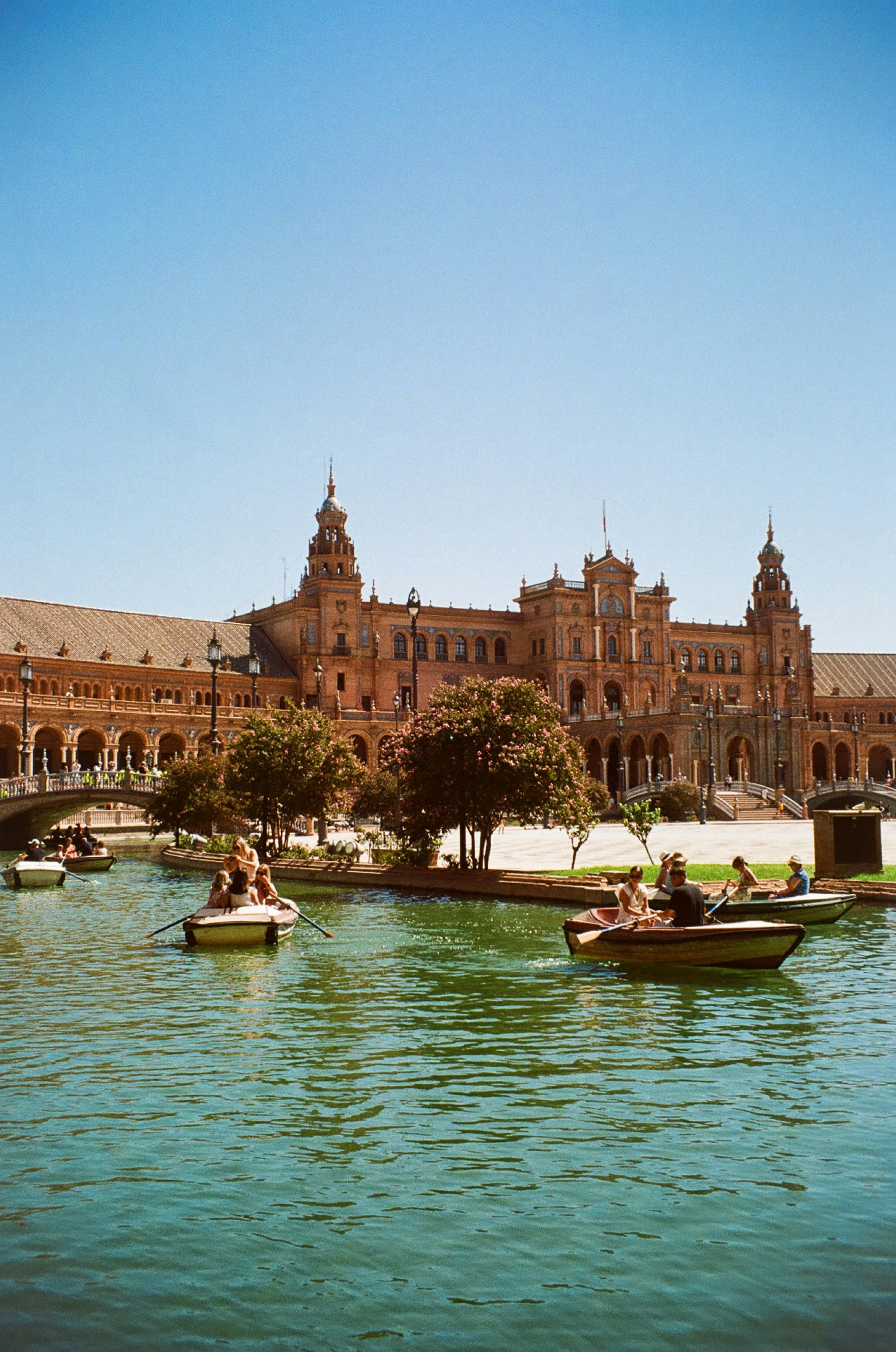 boats on the river in front of buildings