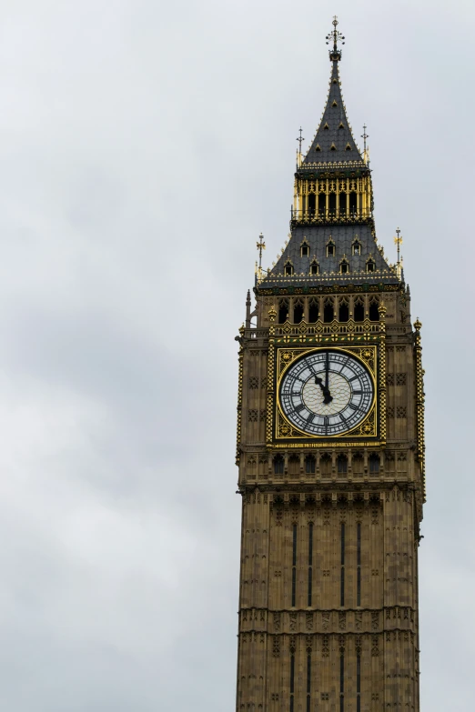 a very tall clock tower towering over a city