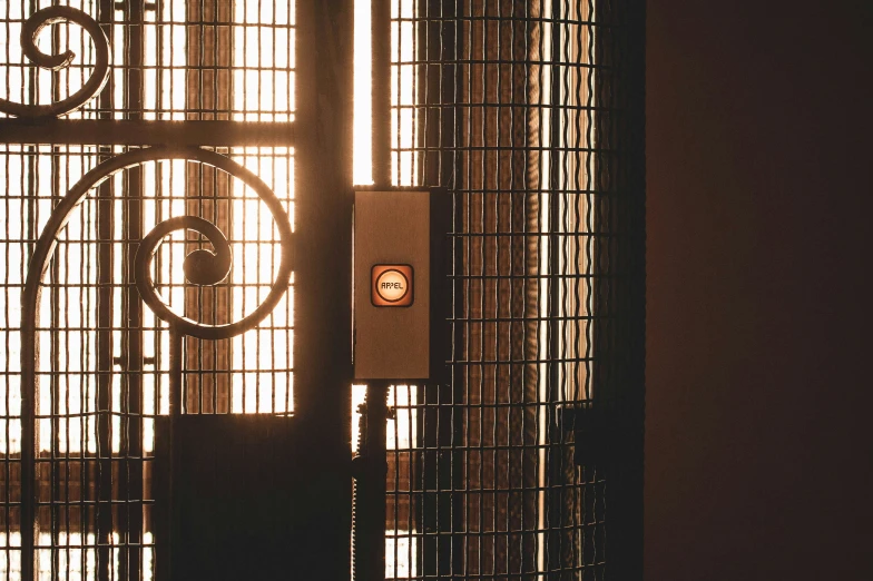 an door is seen through the bars of a building