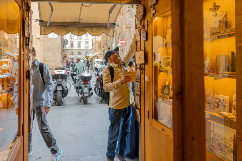 a man taking a selfie while standing inside a store