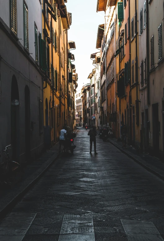 people walking through a street in a small village