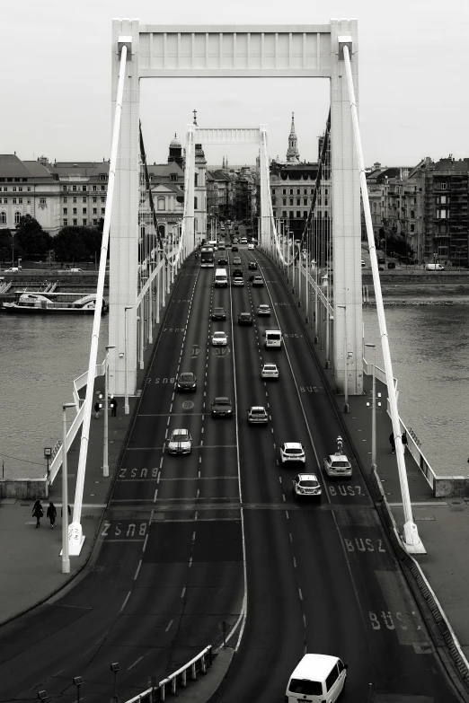 a very long bridge filled with lots of traffic