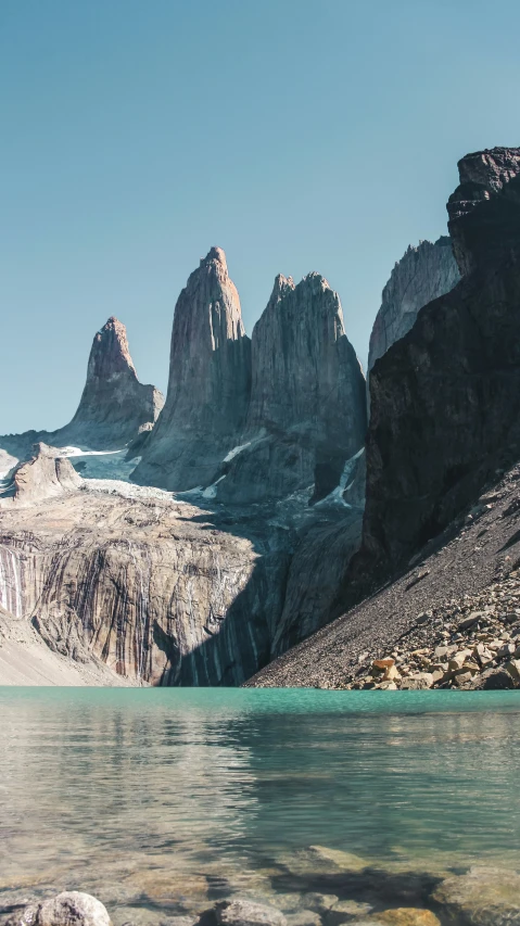 the view of mountains from an icy body of water