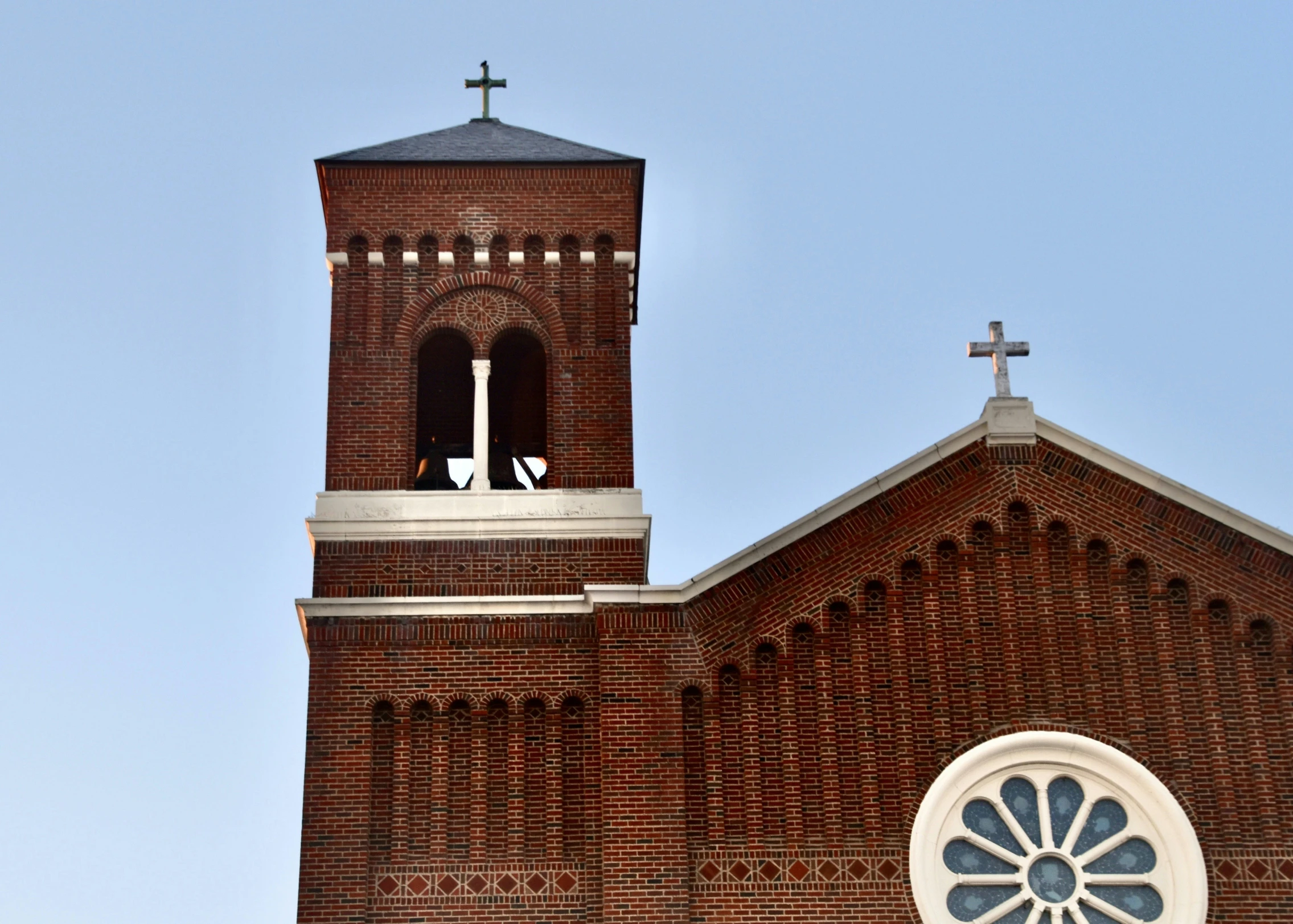 the sun is shining down on the church's tower