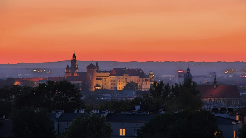 the view of an old castle in a city