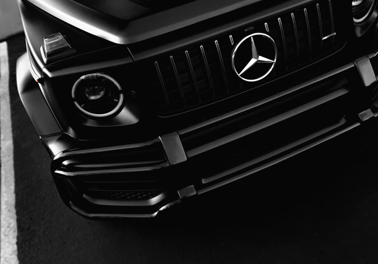 a black and white image of a mercedes g - class