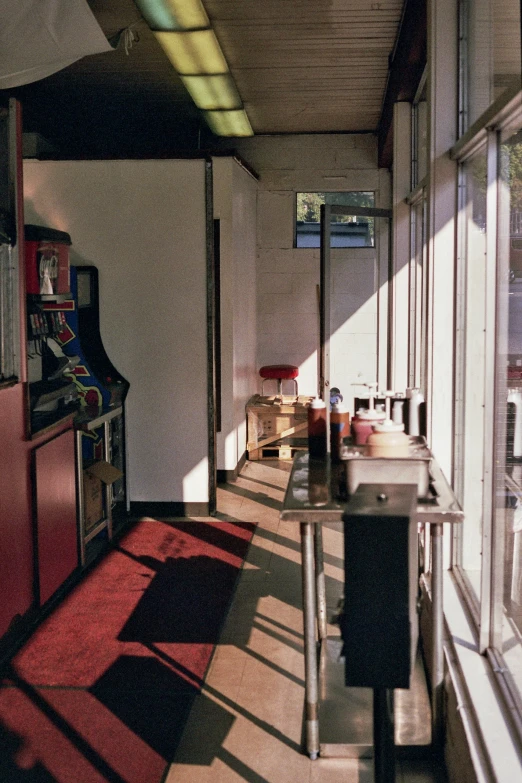 a room with many windows and a colorful carpet